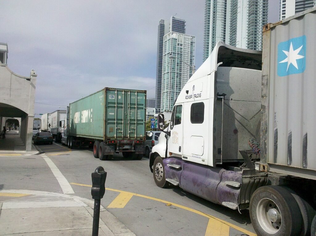 container trucks taking imported sugar from the port to a sugar distributor